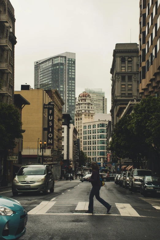 a person crossing a street in a city, by Matt Stewart, unsplash contest winner, renaissance, sf, high rise buildings, dingy city street, background image