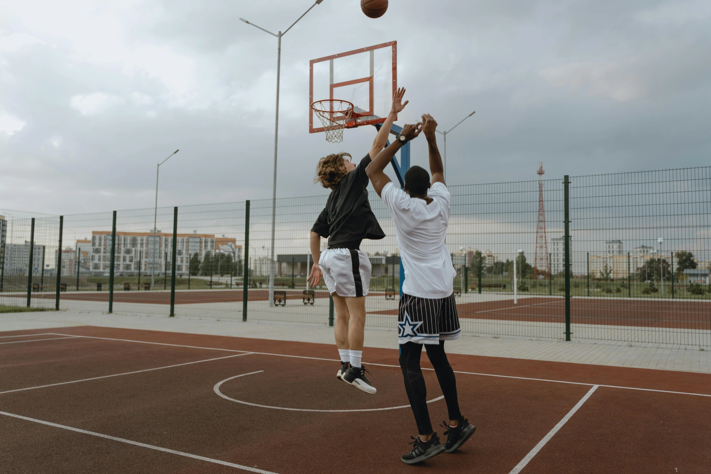 a group of young men playing a game of basketball, by Matija Jama, pexels contest winner, realism, uniform off - white sky, 15081959 21121991 01012000 4k