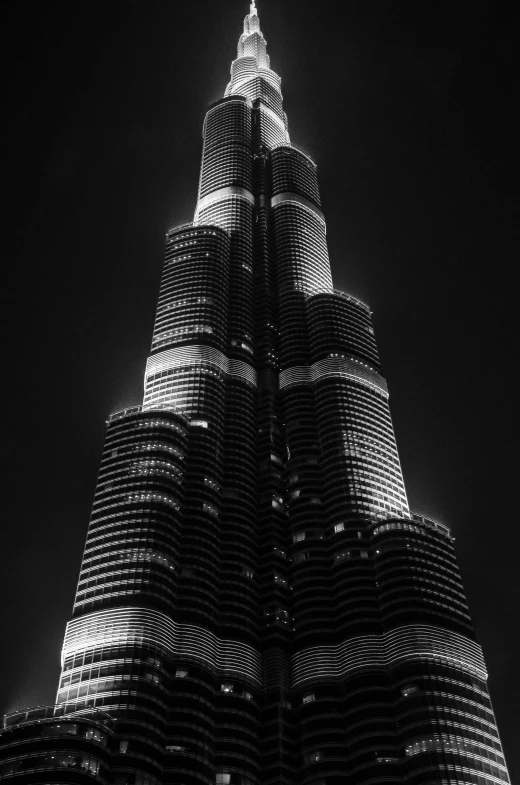 a black and white photo of the burjra tower, by Erik Pevernagie, the lights are on, фото девушка курит, a pair of ribbed, brutal archi