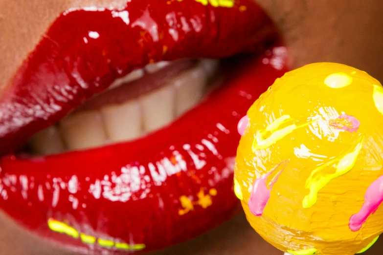 a close up of a person holding a lollipop, a photorealistic painting, inspired by Bert Stern, trending on pexels, pop art, sexy lips :5 stylish, glossy yellow, aida muluneh, covered in ketchup