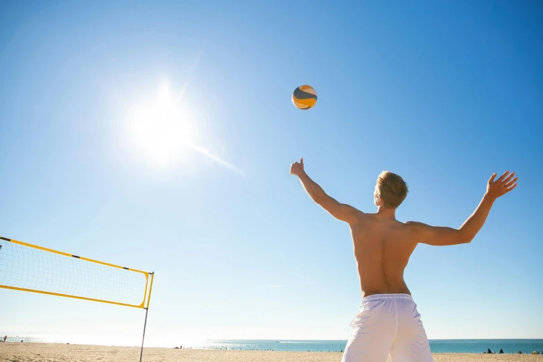 a man is playing volleyball on the beach, unsplash, arabesque, square, on a hot australian day, very sunny, 15081959 21121991 01012000 4k