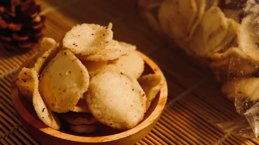 a close up of a bowl of food on a table, an album cover, inspired by Li Di, trending on pexels, renaissance, crispy buns, ginger, vinayak, crisp image texture