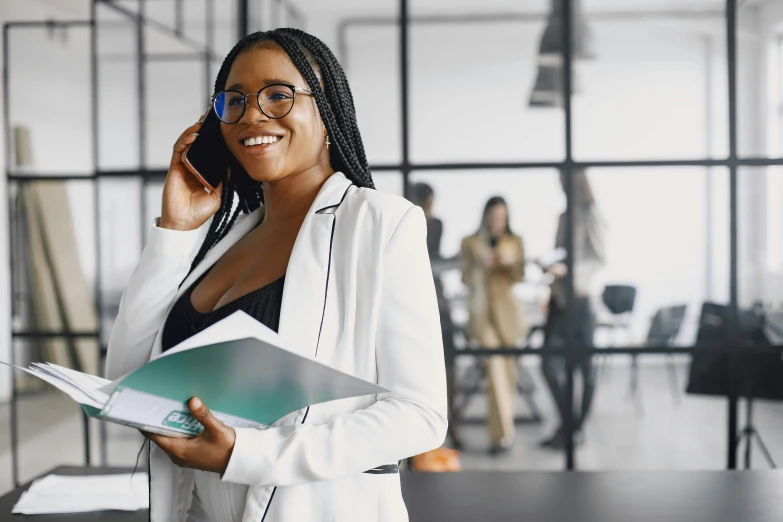 a woman standing in an office talking on a cell phone, trending on pexels, nerdy black girl super hero, thumbnail, low quality photo, healthcare worker