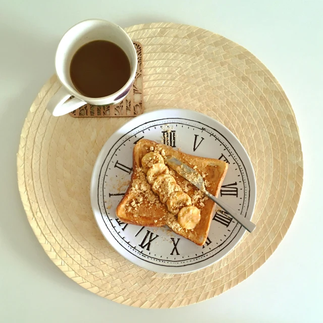 a white plate topped with toast next to a cup of coffee, by Mathias Kollros, pexels contest winner, banana, musee d'orsay 8 k, kintsugi!!, blond