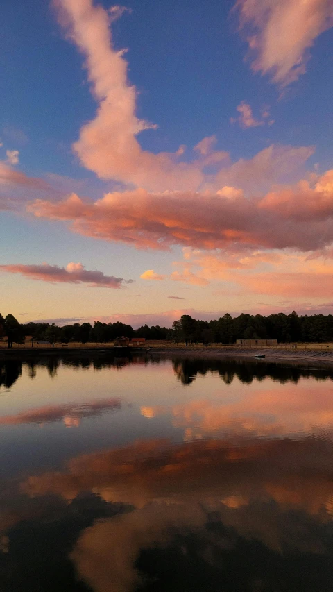 a body of water with some clouds in the sky, pink golden hour, parks and lakes, instagram photo, no cropping