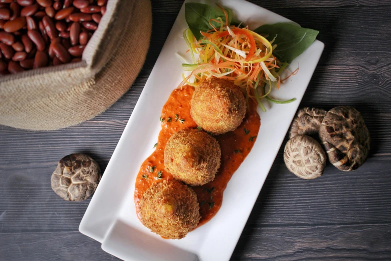 a close up of a plate of food on a table, bongos, puffballs, monsoon, profile image