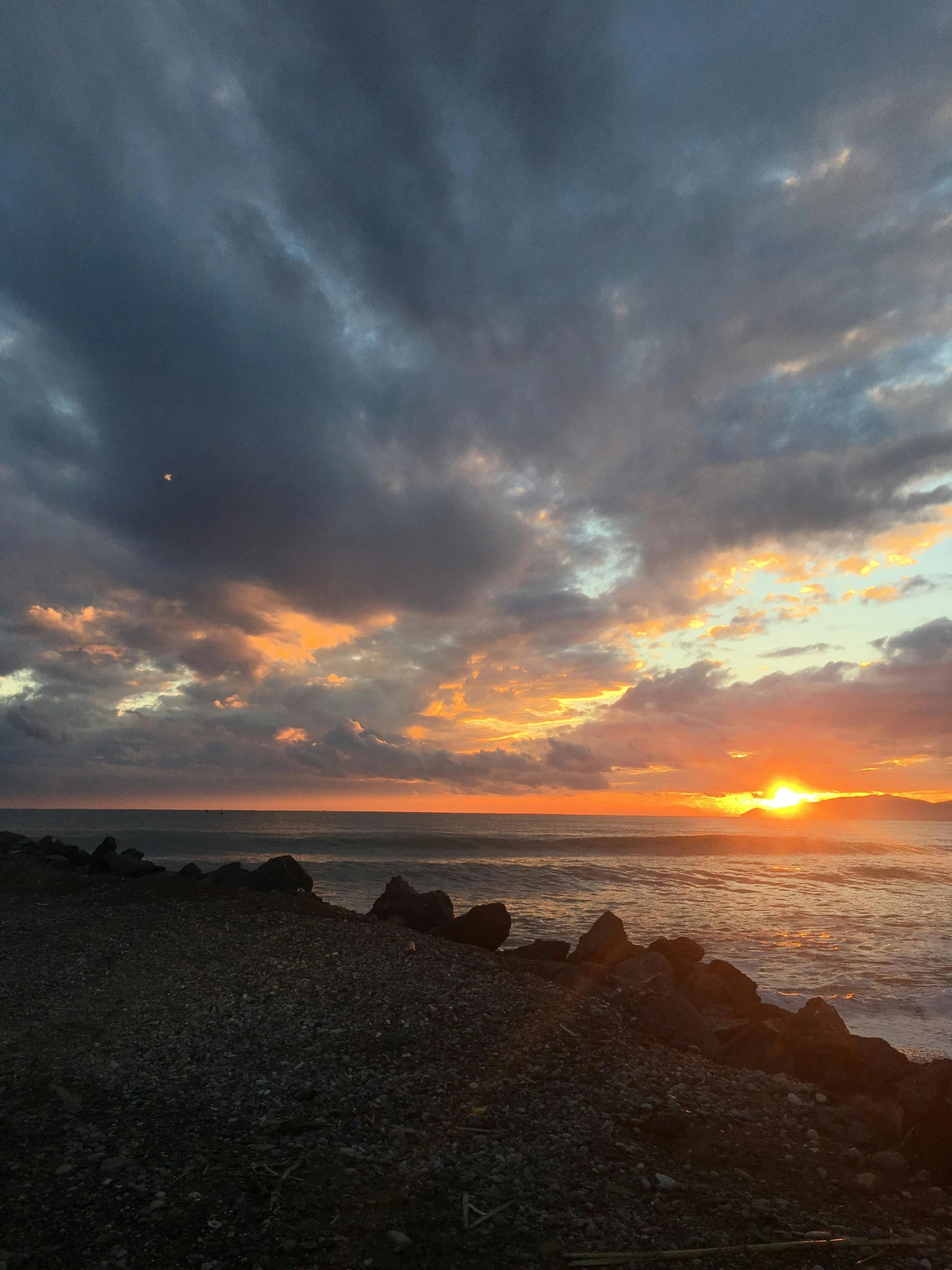 the sun sets over the ocean on a cloudy day, a picture, happening, reunion island, golden hour photograph, trending photo