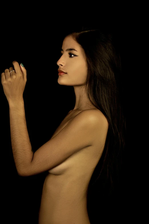 a naked woman standing in front of a black background, an album cover, 5 0 0 px models, hand gesture, olive skin, dark long hair