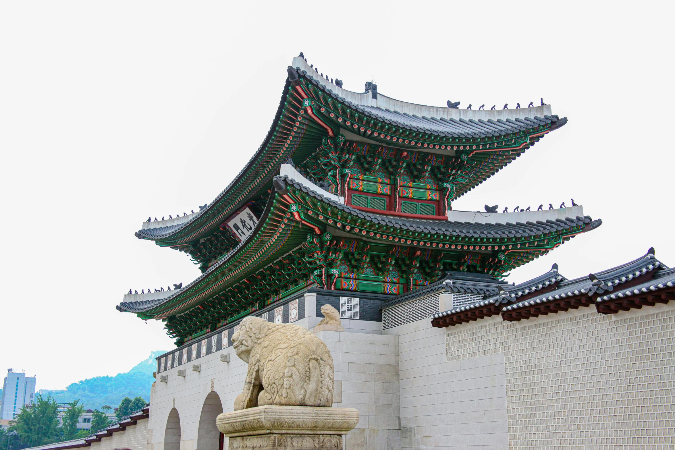 a statue of a bear in front of a building, inspired by Kim Hong-do, trending on unsplash, renaissance, korean traditional palace, 2 0 0 0's photo, square, ornate palace made of green