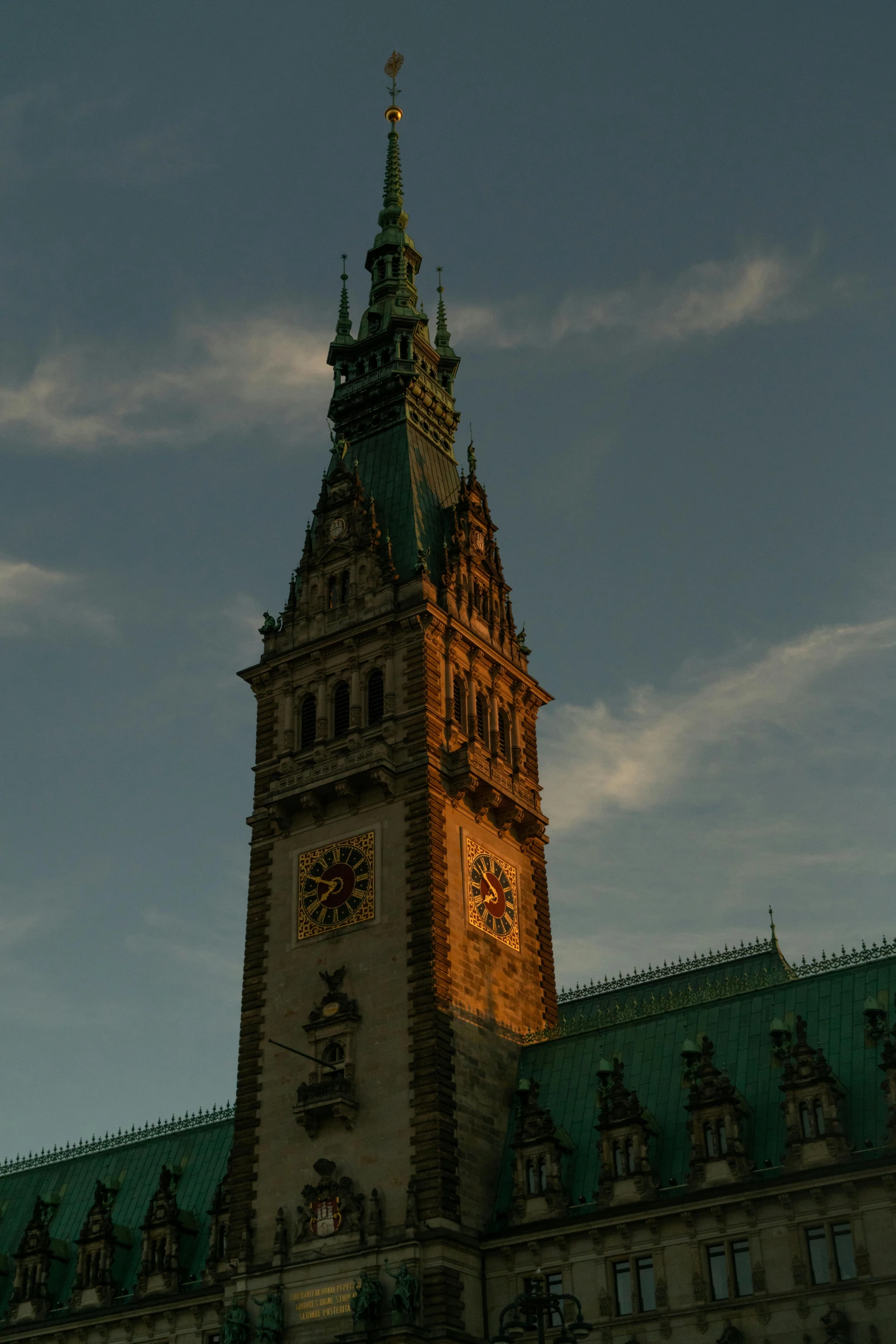 a tall tower with a clock on top of it, at the golden hour, library of congress, devils horns, 8 k detail