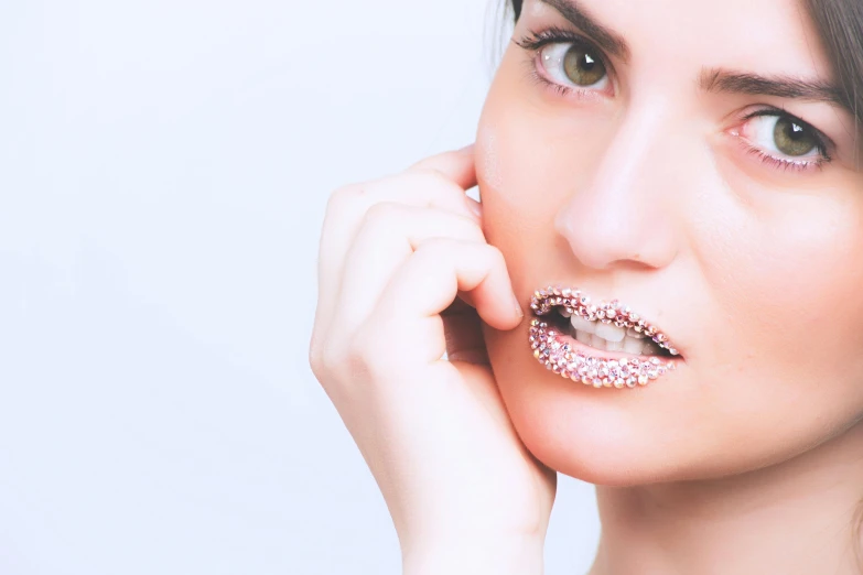 a close up of a person with a tooth brush, a stipple, inspired by Hedi Xandt, trending on pexels, aestheticism, jewelled, thin light pink lips, white background : 3, intricate led jewellery