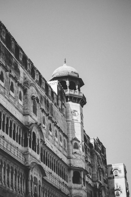 a black and white photo of an old building, by Riza Abbasi, pexels contest winner, baroque, watch tower, mane, colours, square