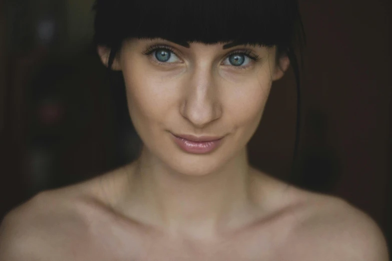 a close up of a woman with blue eyes, a character portrait, inspired by Elke Vogelsang, pexels contest winner, woman with black hair, slender symmetrical face, medium portrait top light, mid body portrait