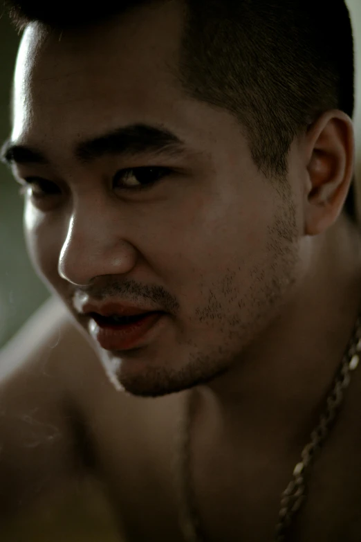 a close up of a man with a chain around his neck, inspired by Eddie Mendoza, official music video, half asian, lean man with light tan skin, shot on 85mm