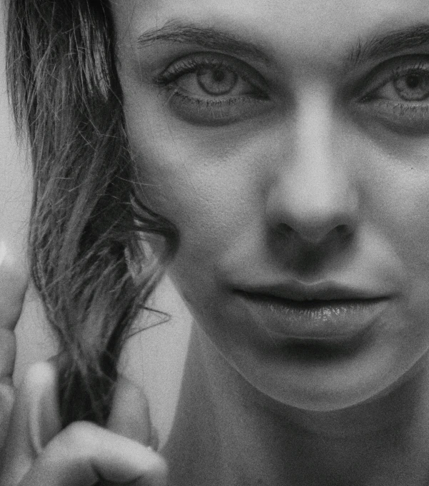 a black and white photo of a woman brushing her hair, a photorealistic painting, inspired by andrey ryabovichev, cgsociety contest winner, hyperrealism, closeup!!!!!!, highly detailed vfx portrait of, drawing 4k, detailed unblurred face