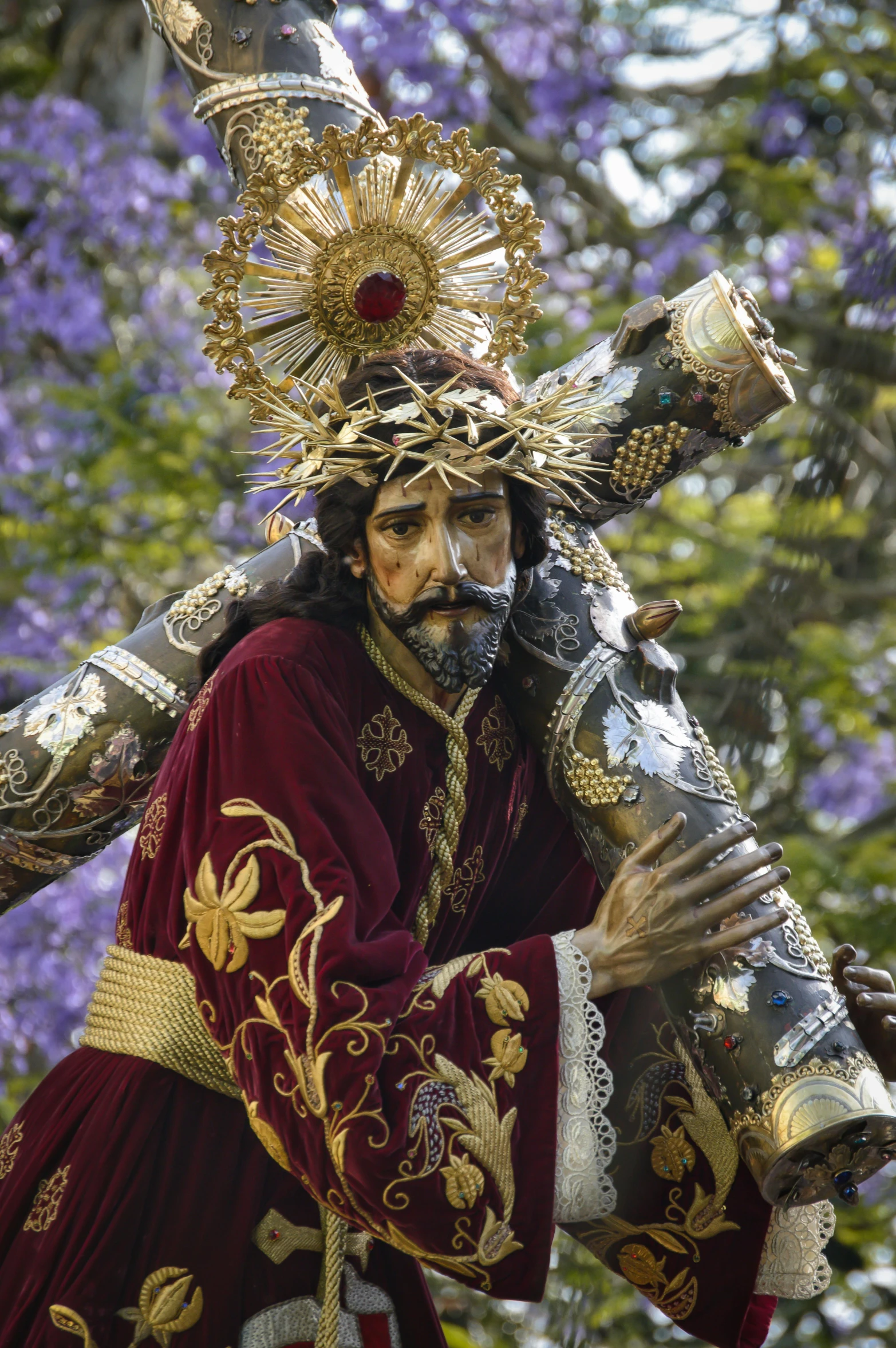 a statue of jesus carrying the cross, an album cover, pexels contest winner, baroque, jeweled costume, in spain, wearing a crown of vines, tlaquepaque