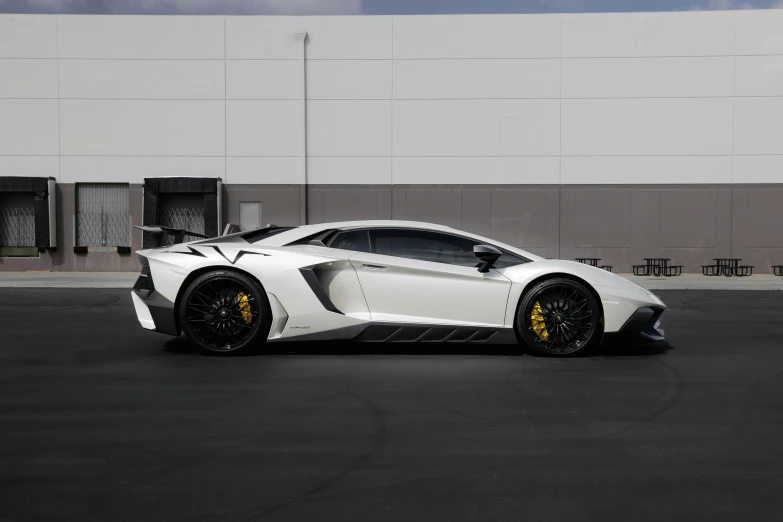 a white sports car parked in a parking lot, lamborghini aventador photoshoot, side view profile centered, fully armored, ultra high res