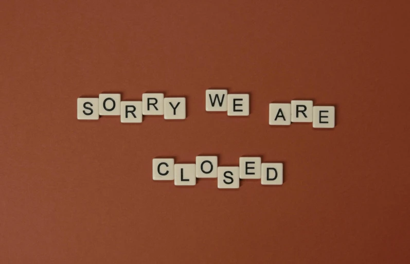 a sign that says sorry we are closed, by Andries Stock, pexels, style of the game rimworld, background image, broken vending machines, broken tiles