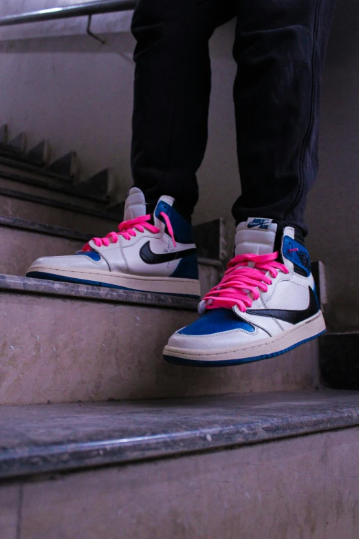 a person standing on a set of stairs, an album cover, by Niko Henrichon, unsplash, renaissance, air jordan 1 high, blue and pink, “air jordan 1, hyperdetailed!!