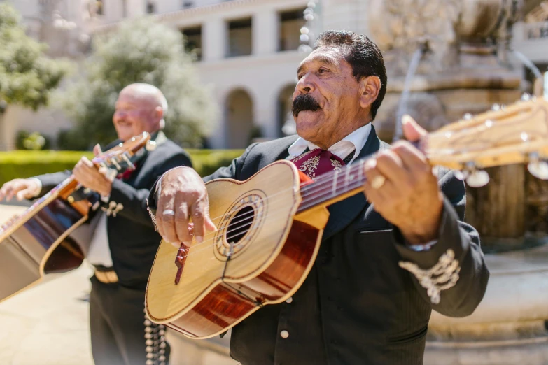 a group of men standing next to each other holding guitars, pexels contest winner, renaissance, old mexican magician closes eyes, the city of santa barbara, long twirling moustache, thumbnail