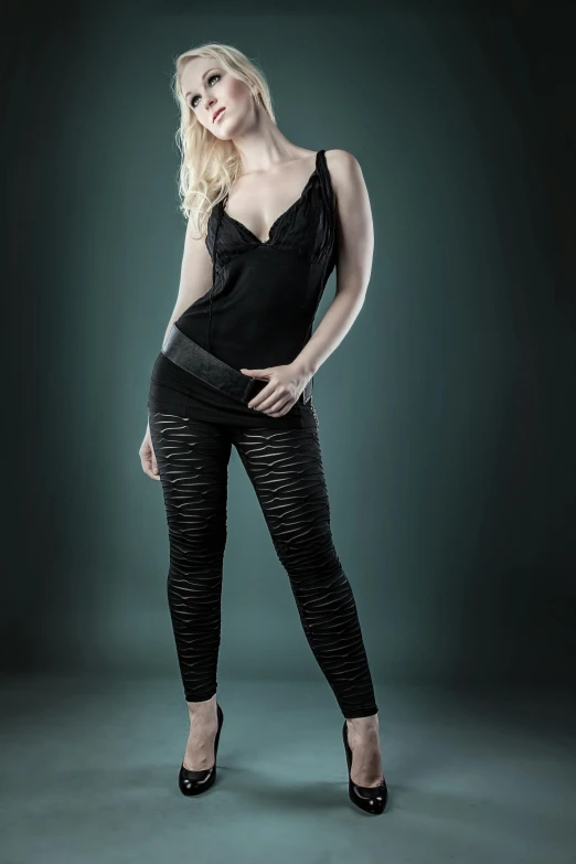 a woman posing in a black top and leggings, trending on cgsociety, renaissance, highly detailed soft lighting, zirconium pants, promo image, highly realistic photograph