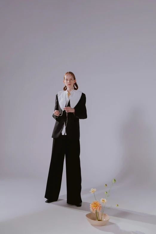 a woman in a tuxedo talking on a cell phone, an album cover, unsplash, full body full height, blooming, kirsi salonen, pose 4 of 1 6