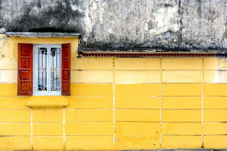 a red fire hydrant sitting in front of a yellow building, a photo, pexels contest winner, minimalism, vietnam, windows and walls :5, silver and yellow color scheme, old house
