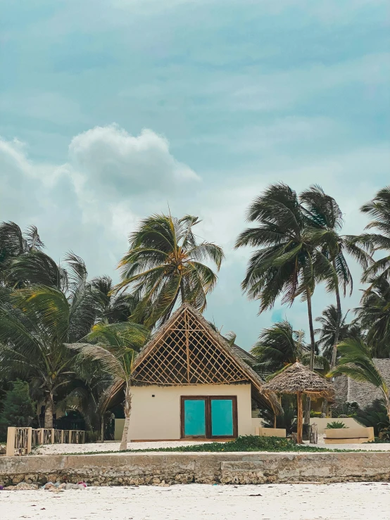 a hut on the beach with palm trees in the background, by Emma Andijewska, pexels contest winner, freddy mamani silvestre facade, teal aesthetic, thumbnail, multiple stories