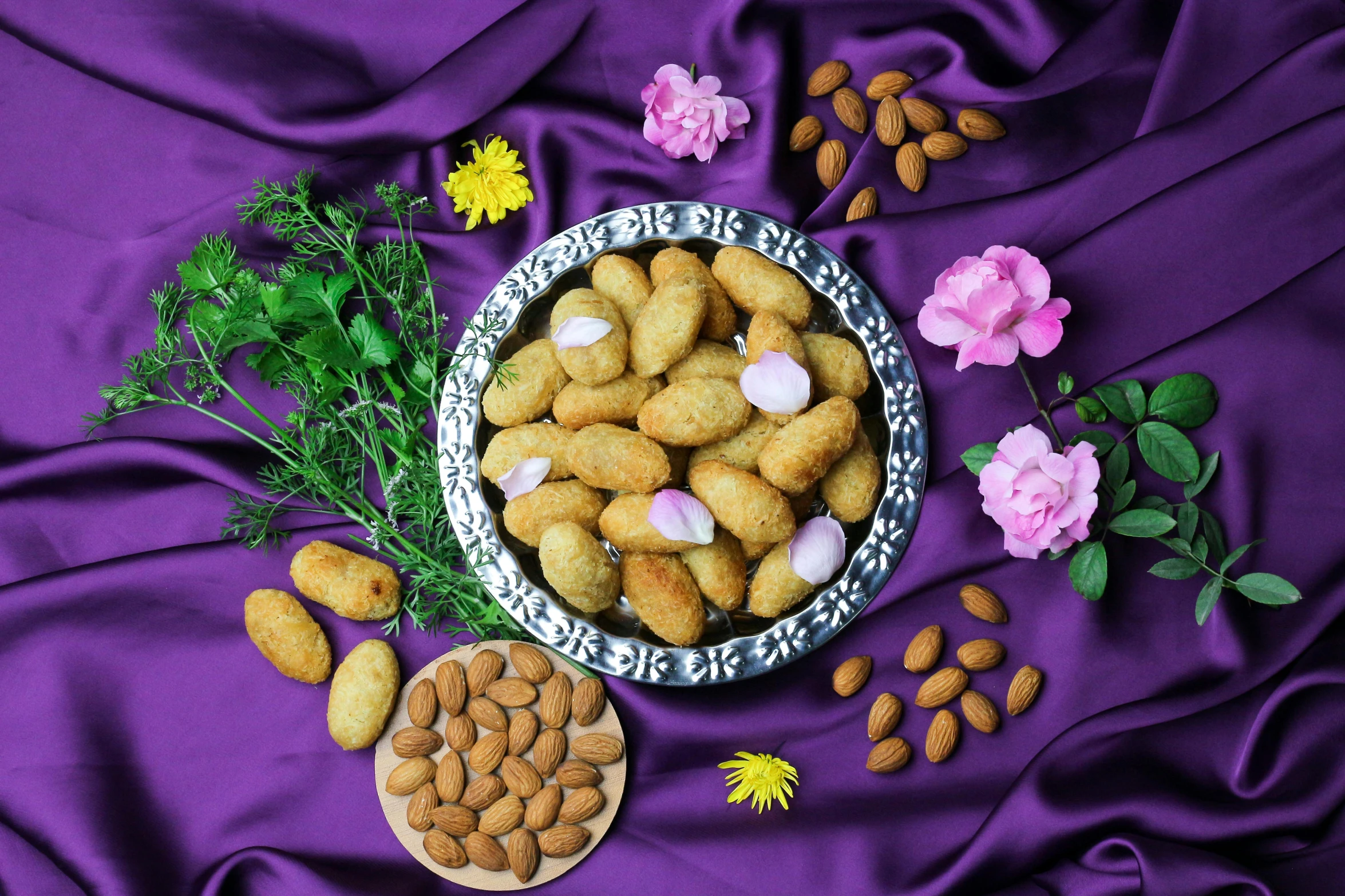 a bowl filled with nuts on top of a purple cloth, dau-al-set, flowers in background, background image, piroca, crisp image