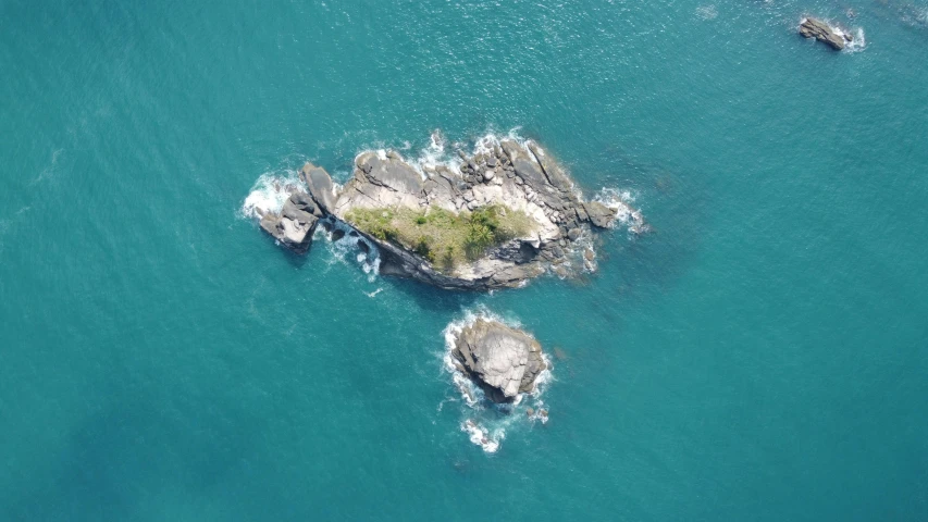 a small island in the middle of the ocean, by Jessie Algie, pexels contest winner, land art, wellington, monkey island, farol da barra, isomeric view