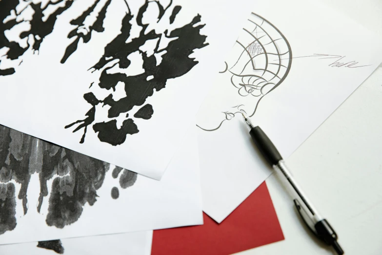 a pair of scissors sitting on top of a table, an ink drawing, trending on pexels, arbeitsrat für kunst, one big inkblot on the paper, portrait close - up, fashion design, manga pen