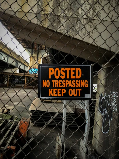 a sign that says posted no trespassing keep out, an album cover, inspired by Elsa Bleda, temporary art, medium [ graffiti, industrial aesthetic, joel meyerowitz, hyperrealistic ”