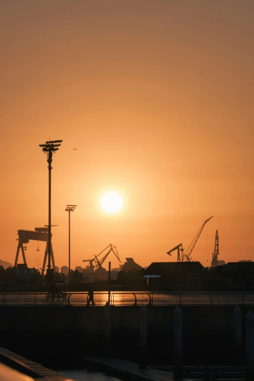 the sun is setting over a body of water, happening, shipyard, oman, high-quality photo, lisbon