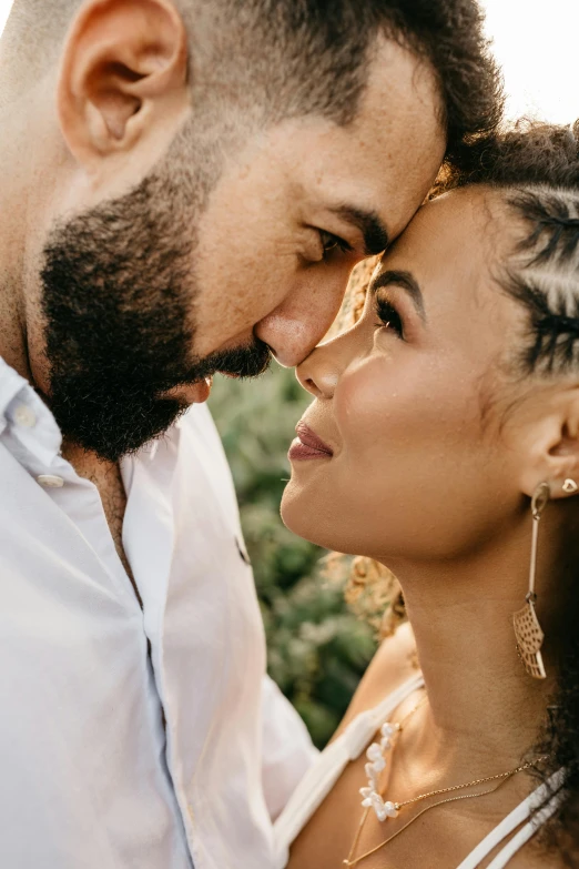 a man and woman looking into each other's eyes, trending on unsplash, black curly beard, brazil, wedding photo, close up of face