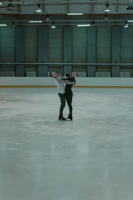 a man riding a skateboard on top of an ice rink, an album cover, unsplash, arabesque, hugging each other, 4 k film still, twin motion, caspar david