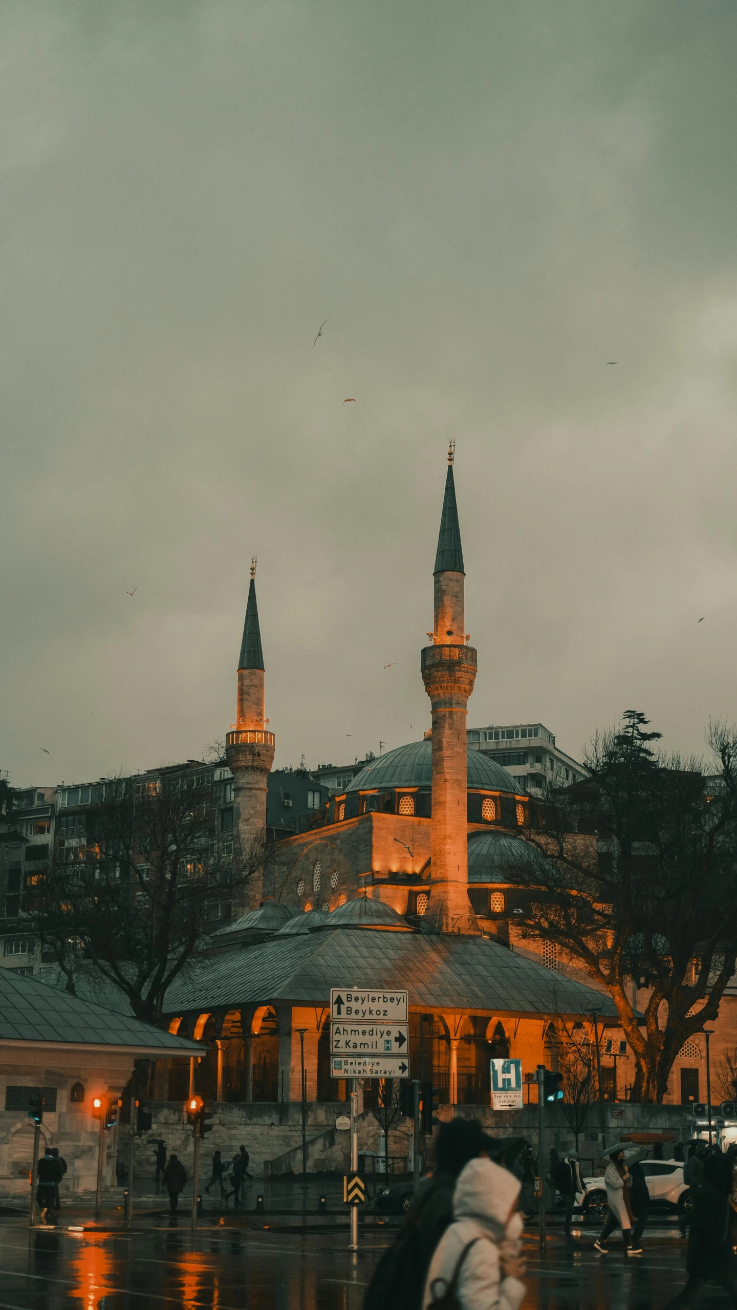 a group of people standing in front of a building, by Ismail Acar, pexels contest winner, hurufiyya, neoclassical tower with dome, evening time, two towers, ottoman sultan