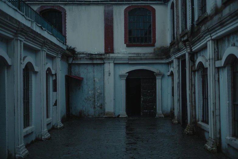 a building with a clock on the top of it, a matte painting, by Elsa Bleda, pexels contest winner, quito school, dark alleyway, inside on a rainy day, courtyard, horror movie still