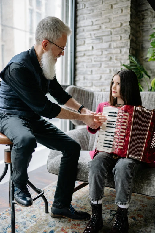 a man playing an accordion with a little girl, pexels contest winner, renaissance, old gigachad with grey beard, youtube thumbnail, teenage girl, in a living room