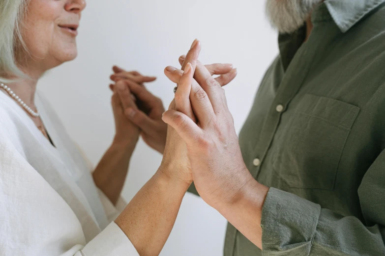 a man putting a ring on a woman's finger, unsplash, tai chi, two skinny old people, cysts, profile image