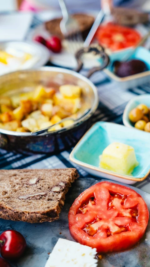 a table topped with lots of different types of food, by Lee Loughridge, unsplash, dau-al-set, potato, square, bright morning, blue