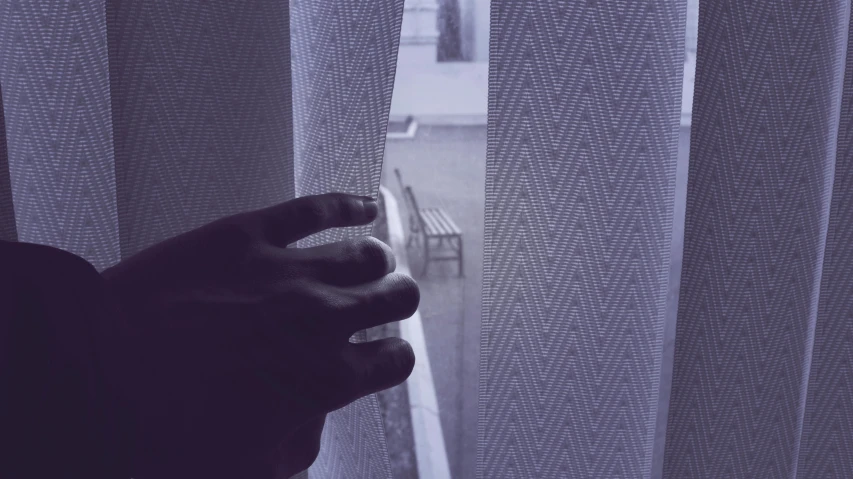 a person that is looking out of a window, curtain, hand on the doorknob, instagram photo, cold