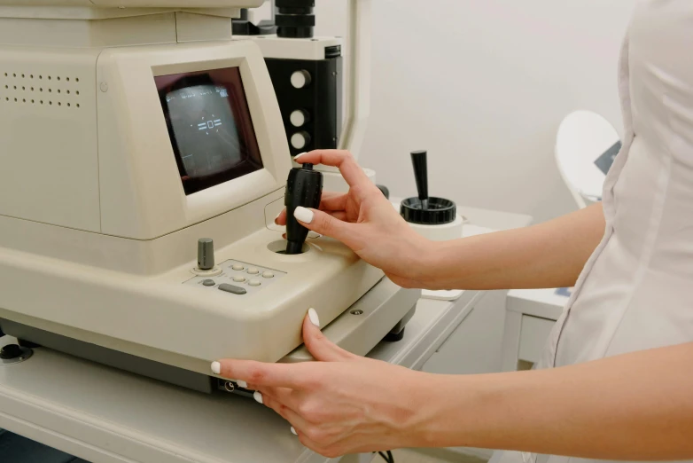 a close up of a person using a machine, a very macular woman in white, luxury equipment, brown, visible veins