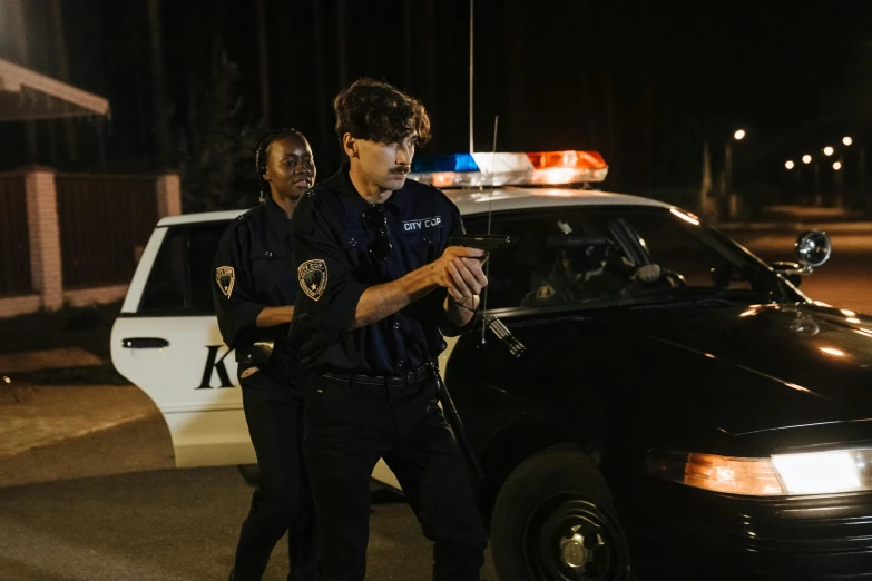 a couple of men standing next to a police car, by Carey Morris, pexels, serial art, adam driver, during the night, getting ready to fight, profile image