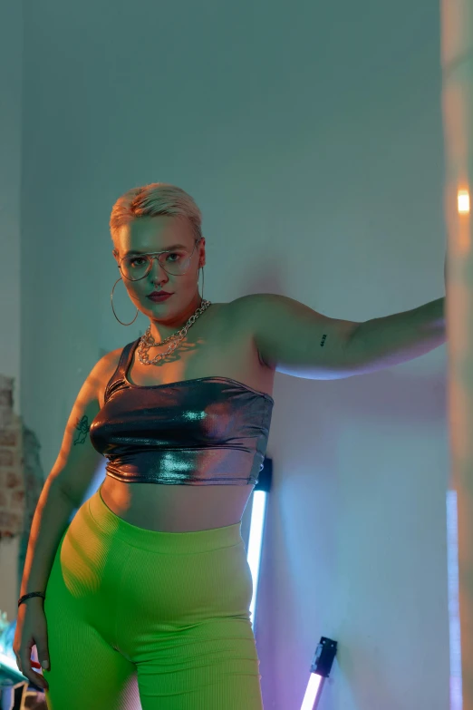 a woman standing in a room with neon lights, inspired by Elsa Bleda, holography, plus-sized, midriff, hybrid human/tank, nonbinary model