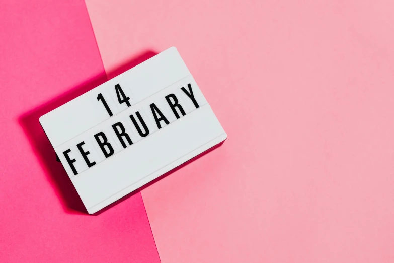 a white sign that says 14 february on a pink and pink background, trending on pexels, happening, background image, lunar time, contain, d. i. y. venue