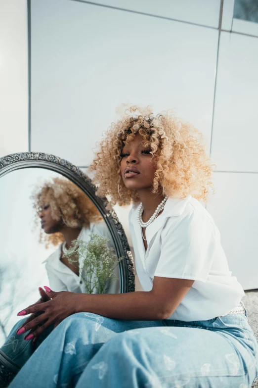 a woman sitting on the ground in front of a mirror, trending on pexels, renaissance, short blonde afro, long fluffy blond curly hair, african american woman, pastel'