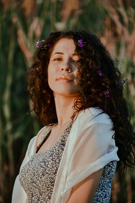 a woman with curly hair and flowers in her hair, beatifully lit, eytan zana, no cropping, peaceful