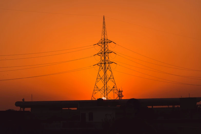 the sun is setting behind the power lines, pexels contest winner, realism, orange hue, tower, electrical aura, telephoto shot