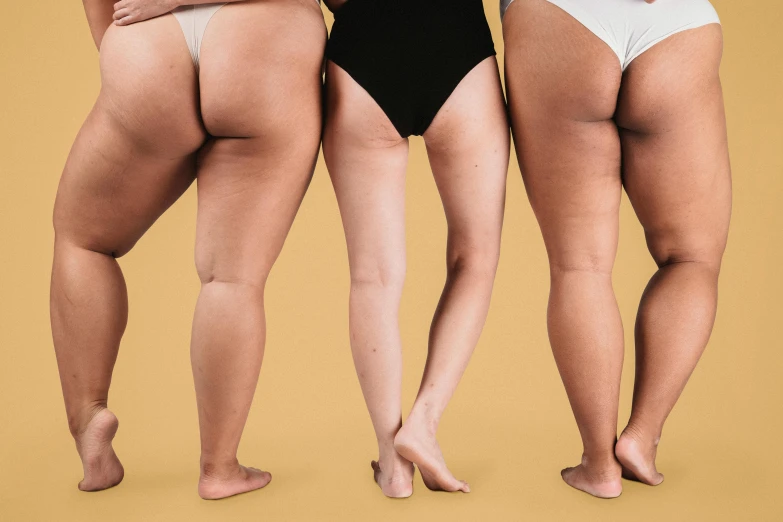 a group of three women standing next to each other, by Jessie Algie, trending on pexels, renaissance, round thighs, thick linings, bum, supportive