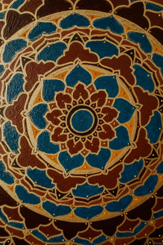 a close up of a painting on a wall, a detailed painting, by Joe Stefanelli, trending on unsplash, cloisonnism, lotus mandala, brown red blue, islamic, chocolate art